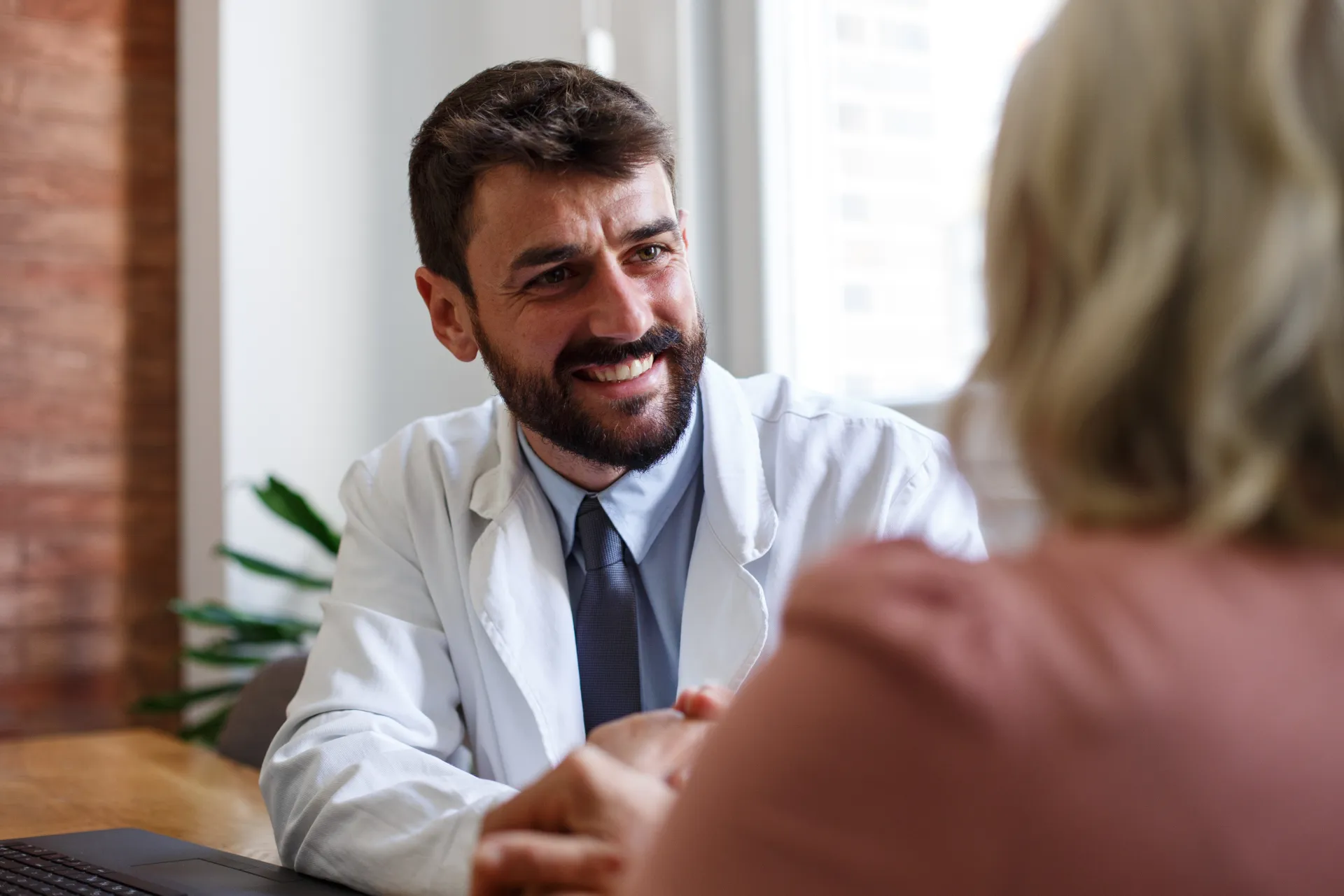 Busy restaurant with guests enjoying a dining experience in an elegant setting