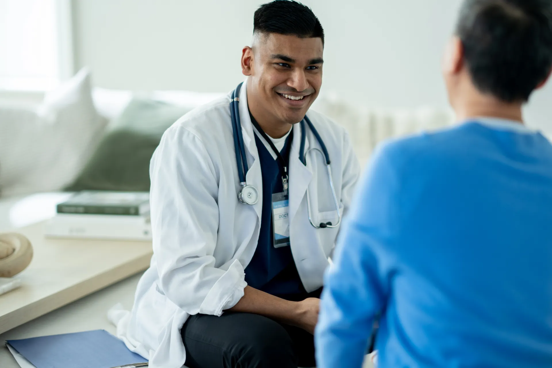 Real estate agent showing a property to prospective buyers in a modern home